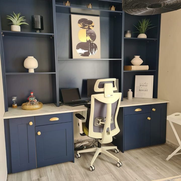 Navy home office with shelves, cupboards and drawers